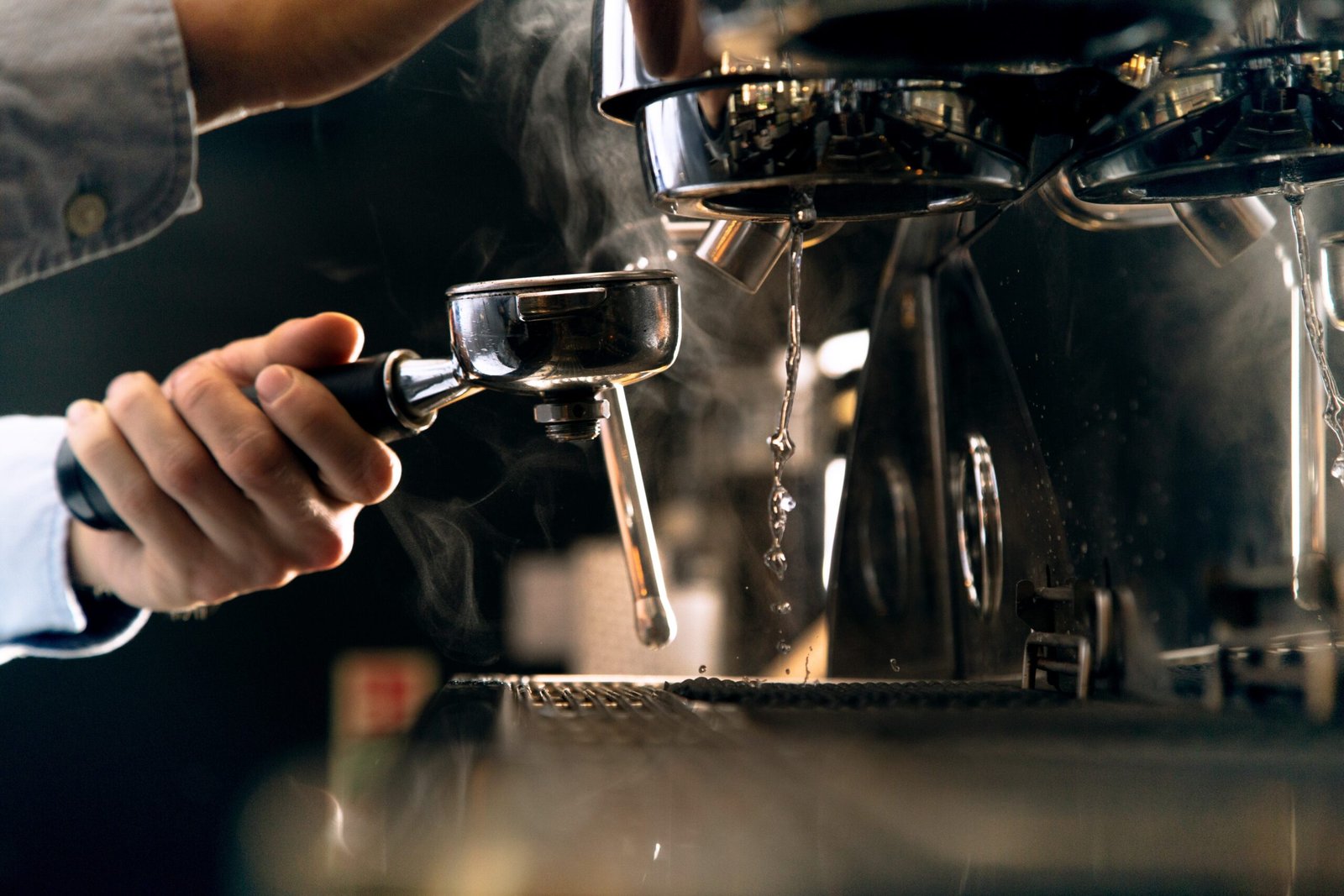 Barista pouring espresso from espresso machine